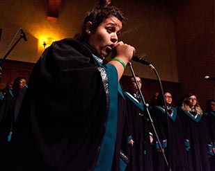 An MVC student sings with a microphone at the annual awards