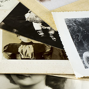 A closeup of a pile of old photos