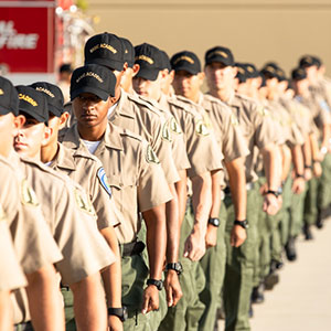 Law cadets line up in front of a fire truck