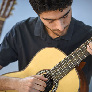 A student plays the guitar