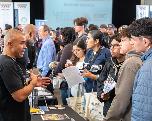 Trade representatives talk to expo attendees