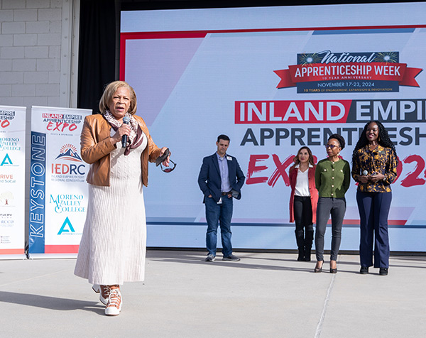 A top tier sponsor speaks to attendees