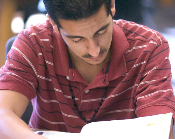 A student reads a textbook