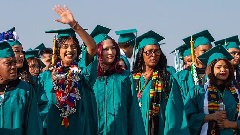 A group of graduates in full regalia