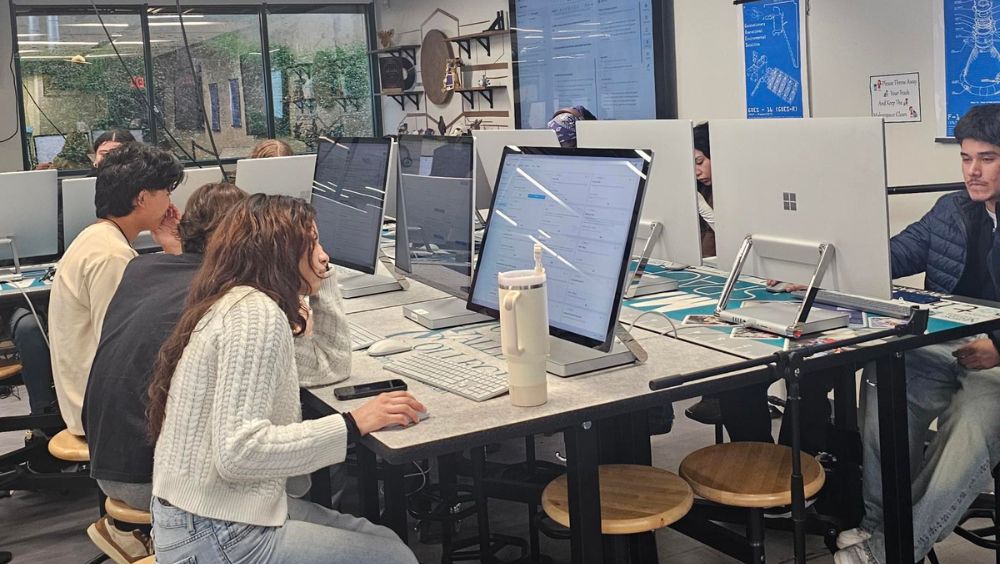 Students work on Microsoft surface pros in the iMAKE Innovation Center