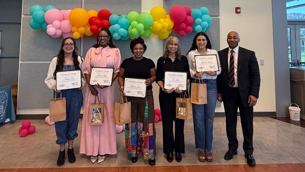 Diversity Award recipients hold up their certificates