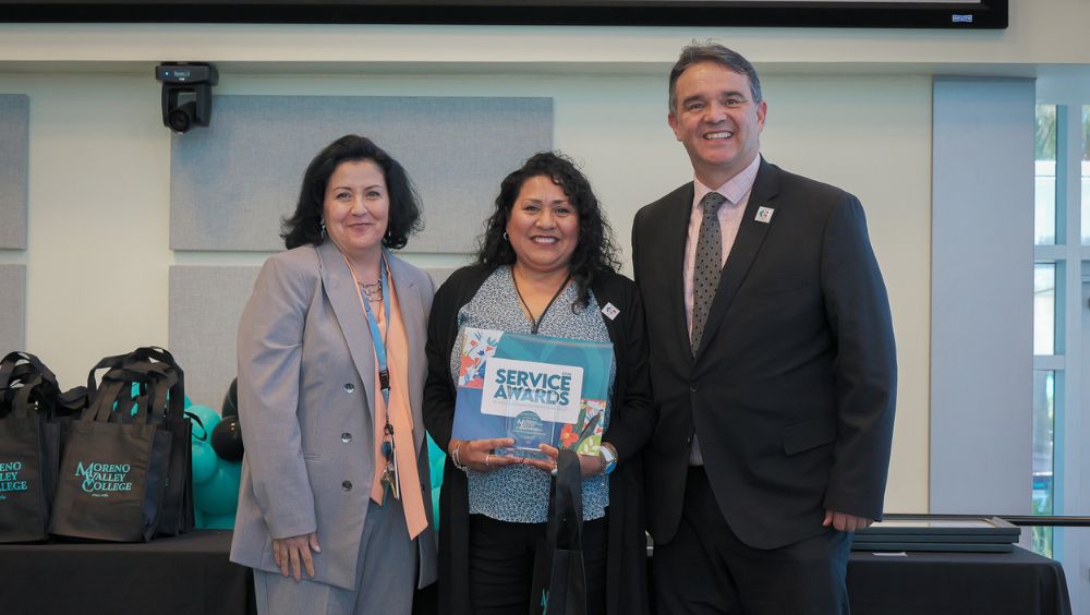 Sabina Fernandez, middle, stands with her VP Academic Affairs Joumana McGowan (left) and college president Rudy Besikof (right)