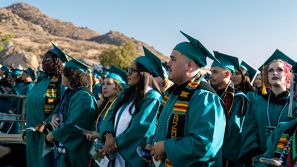 Class of 2026 graduates sit in the stands during the Commencement ceremony
