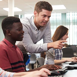 A student is tutored while on the computer