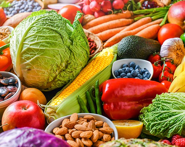 Table filled with colorful fruits and vegetables