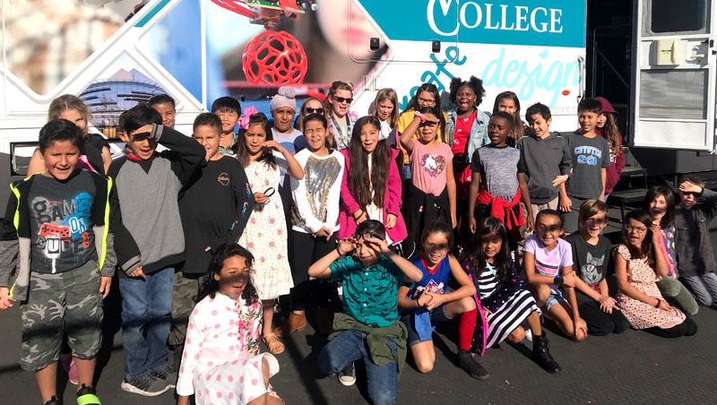 Elementary students next to the iMAKE Mobile Innovation Center