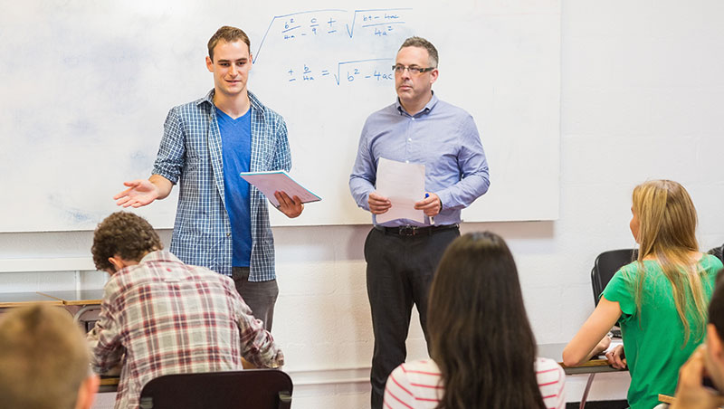 A student presents a topic in front of their class